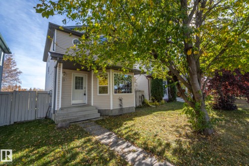 Two-story residence with siding exterior, concrete front steps, and a privacy fence - 137 Michigan Street, Devon, AB 