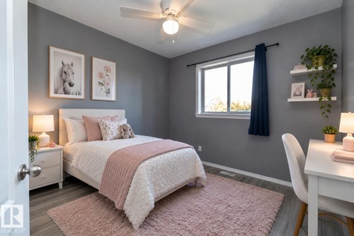 Gray wall tones, wood-finish flooring, a ceiling fan with integrated lighting, a window with a dark fabric curtain, and white floating shelves - 137 Michigan Street, Devon, AB 