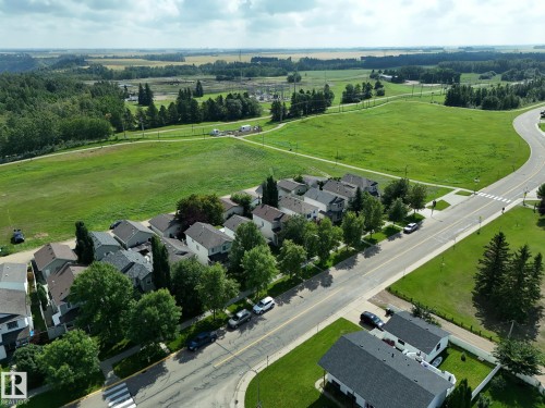 Residential neighborhood with asphalt streets, sidewalks, and street trees - 137 Michigan Street, Devon, AB 