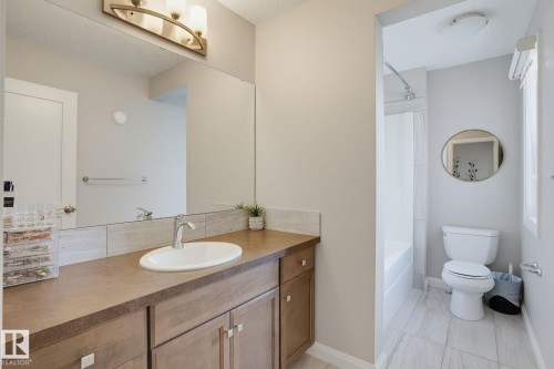 Vanity with a single basin sink and brushed nickel faucet - 9448 228 Street Nw, Edmonton, AB 