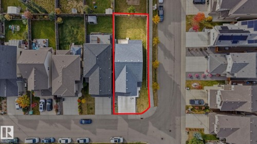 Contemporary residential property with a paved driveway and an attached garage - 9448 228 Street Nw, Edmonton, AB 