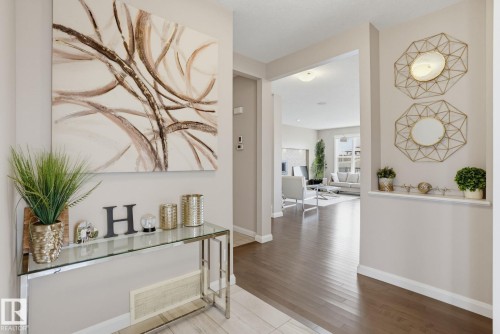 Hardwood-finish flooring, recessed wall niche, and an open archway - 9448 228 Street Nw, Edmonton, AB 