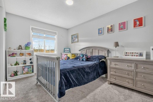 Recessed ceiling light, neutral wall color, and carpeted flooring - 1020 Daniels Loop Sw, Edmonton, AB 
