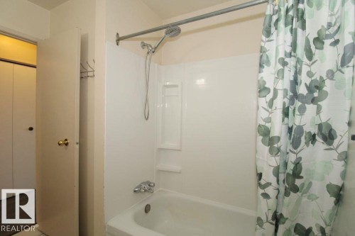 Wood-finish flooring, neutral wall paint, and white trim - 11393 22 Avenue Nw, Edmonton, AB 