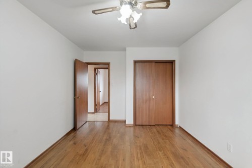 Hardwood flooring and a ceiling fan with integrated lighting - 8424 70 Street Nw, Edmonton, AB 