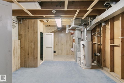 Exposed ceiling joists with visible ductwork and plumbing - 8424 70 Street Nw, Edmonton, AB 