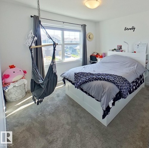 Neutral tone wall paint, flush mount ceiling light fixture, and carpet flooring - 40 Jamison Crescent, St. Albert, AB 