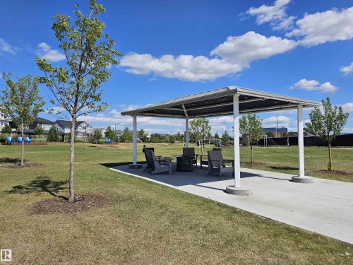 Covered outdoor seating area featuring a metal roof and concrete foundation - 40 Jamison Crescent, St. Albert, AB 