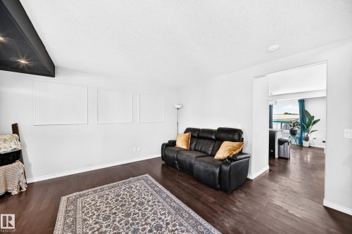 Hardwood flooring, recessed lighting, and a white ceiling create a bright interior - 447 Songhurst Place, Leduc, AB 