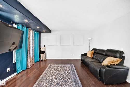 Recessed lighting, wood-finish flooring, and white walls - 447 Songhurst Place, Leduc, AB 