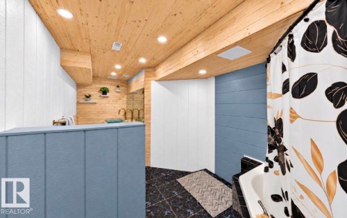 Wood-paneled ceiling with recessed lighting - 447 Songhurst Place, Leduc, AB 