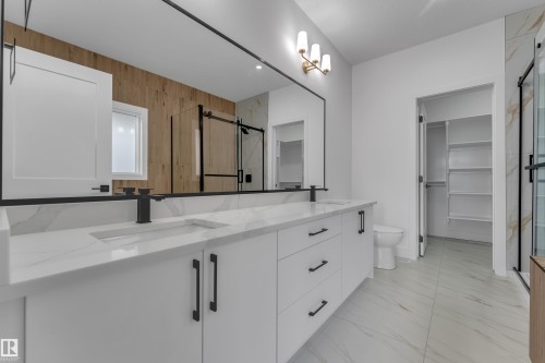 Dual vanity with integrated sinks and white countertops - 178 Munn Way, Leduc, AB 