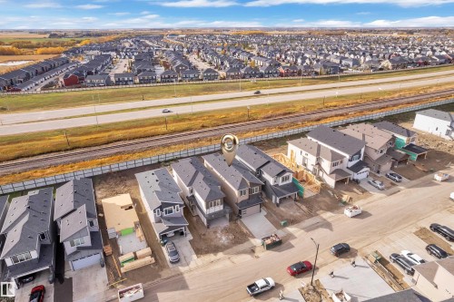 New construction residences with attached garages and multi-story designs, situated in a developing community with highway frontage - 178 Munn Way, Leduc, AB 
