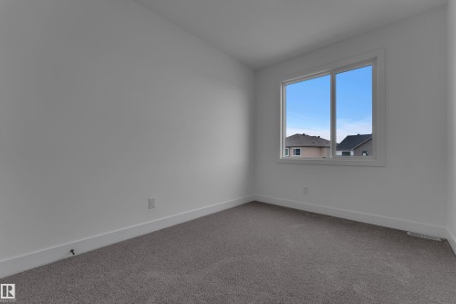 Natural light via a large window - 178 Munn Way, Leduc, AB 