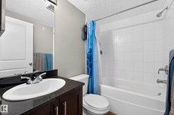 White subway tile shower surround with integrated bathtub - 