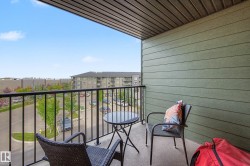 Private balcony featuring a concrete floor and a black metal railing - 