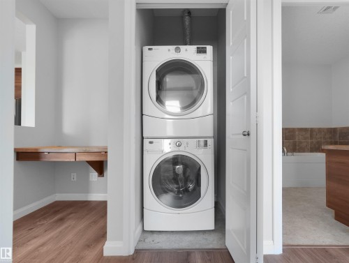 Stackable laundry appliances within a dedicated closet - #415 2588 Anderson Wy Sw, Edmonton, AB 
