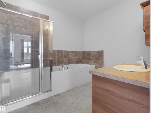 Integrated shower-tub combination with glass enclosure - #415 2588 Anderson Wy Sw, Edmonton, AB 