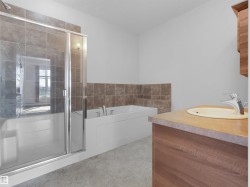Integrated shower-tub combination with glass enclosure - 