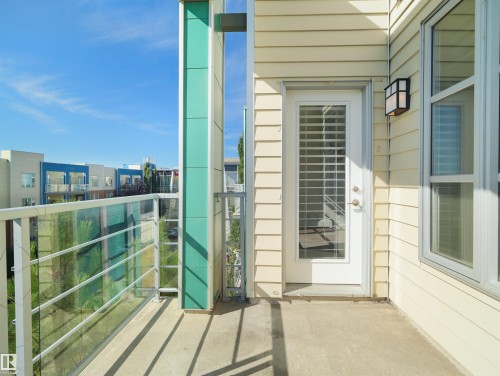 Concrete balcony with a metal and glass panel railing - #415 2588 Anderson Wy Sw, Edmonton, AB 