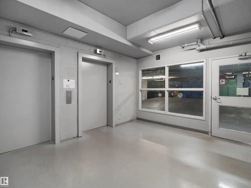 Two elevators with brushed metal call buttons - #415 2588 Anderson Wy Sw, Edmonton, AB 