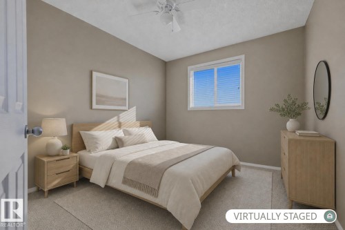 Neutral-toned interior featuring wall-to-wall carpeting, a sliding window with horizontal blinds, and a white ceiling fan with integrated lighting - 9047 Scott Crescent Nw, Edmonton, AB 