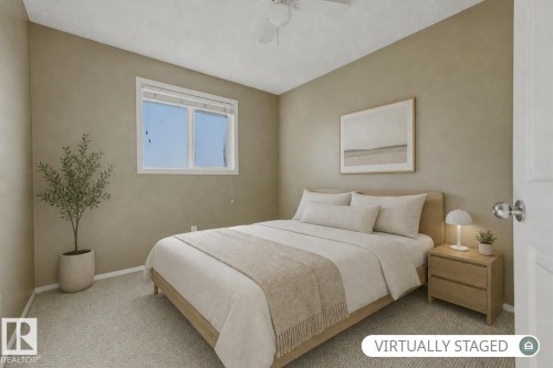 Neutral-toned interior featuring wall-to-wall carpeting, a dual-pane horizontal sliding window, and a ceiling fan with integrated lighting - 9047 Scott Crescent Nw, Edmonton, AB 