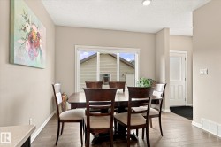 Wood-finish flooring, neutral wall paint, and a sliding glass patio door - 