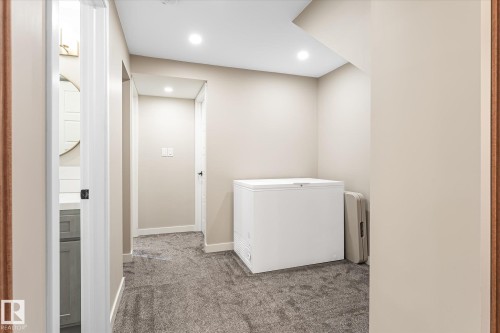 Recessed ceiling lighting, neutral wall paint, gray textured carpeting, and white interior doors - 21935 91 Avenue Nw, Edmonton, AB 