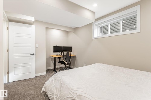Recessed lighting, painted walls, carpeted flooring, and a white interior door - 21935 91 Avenue Nw, Edmonton, AB 