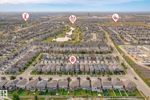 Aerial perspective showcasing a residential neighborhood with varied housing styles - 21935 91 Avenue Nw, Edmonton, AB 