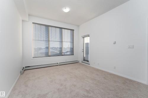 Light-toned carpeting and neutral wall tones create an expansive atmosphere - #403 105 Ambleside Dr Sw, Edmonton, AB 