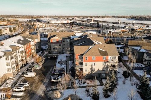 Multi-story residential buildings featuring balconies and a combination of siding and stone facades - #403 105 Ambleside Dr Sw, Edmonton, AB 