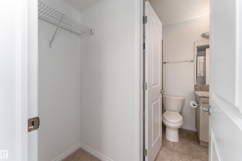 Wardrobe closet with wire shelving - #403 105 Ambleside Dr Sw, Edmonton, AB 