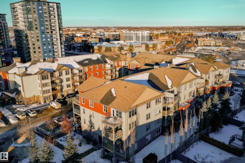 Multi-story residential buildings featuring balconies and gabled roofs - #403 105 Ambleside Dr Sw, Edmonton, AB 
