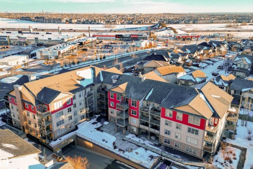 Multi-story residential building with private balconies and exterior parking - #403 105 Ambleside Dr Sw, Edmonton, AB 