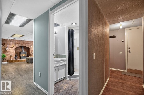 Wood-finish flooring in both spaces - 5502 48 Avenue, Beaumont, AB 