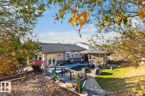 Expansive multi-level deck, screened-in gazebo, and a manicured lawn - 5502 48 Avenue, Beaumont, AB 