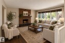 Brick-clad fireplace with a wood mantel - 17311 107 Street Nw, Edmonton, AB 