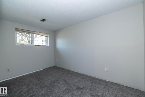 Neutral gray wall finishes and complementing gray carpet - 17311 107 Street Nw, Edmonton, AB 