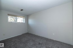 Neutral gray wall finishes and complementing gray carpet - 