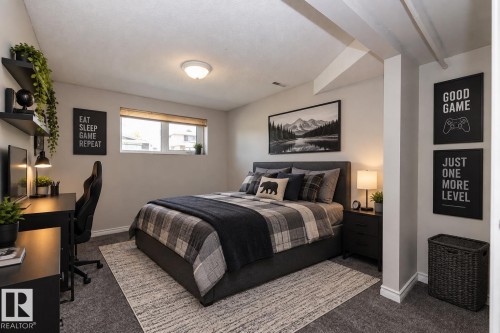 Wall-to-wall carpeting with a light-colored area rug, a window with a blind, and exposed ceiling beams - 17311 107 Street Nw, Edmonton, AB 