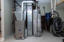 Carrier furnace and hot water tank with visible ductwork - 