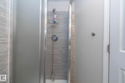 Shower enclosure with frosted glass panel and sliding door - 17311 107 Street Nw, Edmonton, AB 