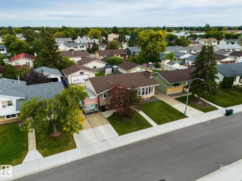 Paved street with concrete sidewalks and mature trees throughout the neighborhood - 17311 107 Street Nw, Edmonton, AB 