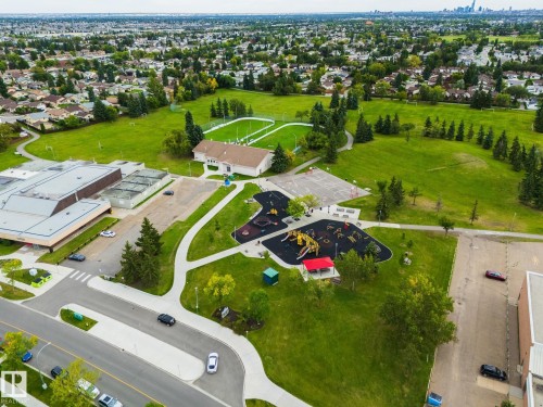 Extensive green spaces with walking paths, multiple sports fields, and a modern playground - 17311 107 Street Nw, Edmonton, AB 