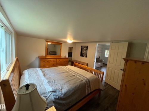 Recessed lighting and a window with a horizontal blind illuminate the space - #15 2319 Twp Road 524, Rural Parkland County, AB 