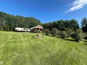 Expansive green lawn with a natural tree line backdrop - #15 2319 Twp Road 524, Rural Parkland County, AB 