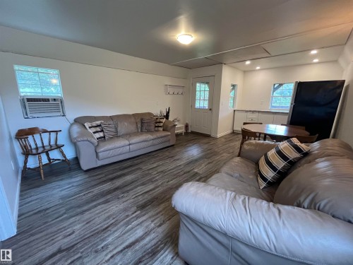 Wood-finish flooring, recessed lighting, ceiling-mounted light fixture, white walls, and a multi-pane door - #15 2319 Twp Road 524, Rural Parkland County, AB 