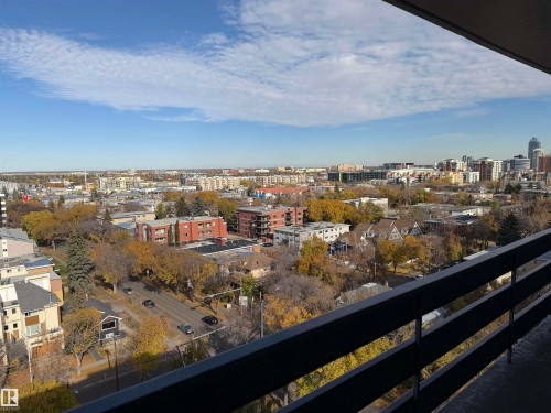 Elevated outdoor balcony featuring black metal railing and expansive urban skyline scenery - #1304 10160 116 St Nw, Edmonton, AB 